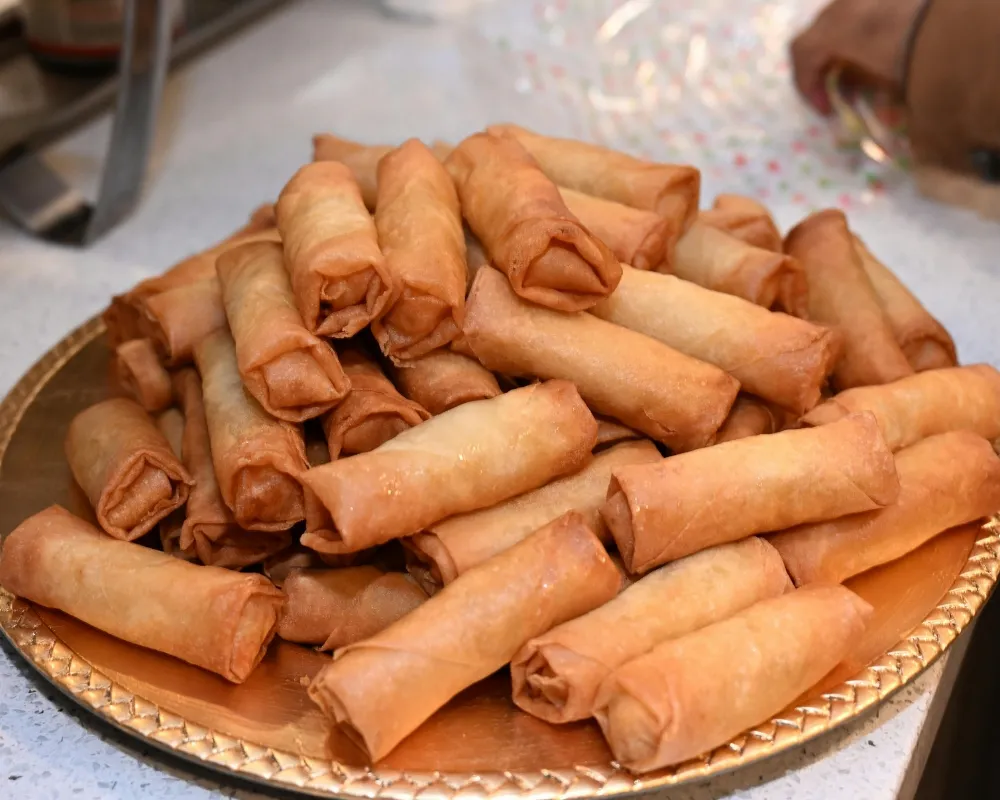 Crispy golden fried spring rolls stacked on plate at China Star Chinese Buffet，a Chinese Restaurant in Waco
